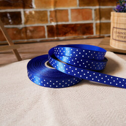 ริบบิ้นผ้าสีน้ำเงิน พิมพ์ลายจุดสีขาว ขนาด 1.2 cm.